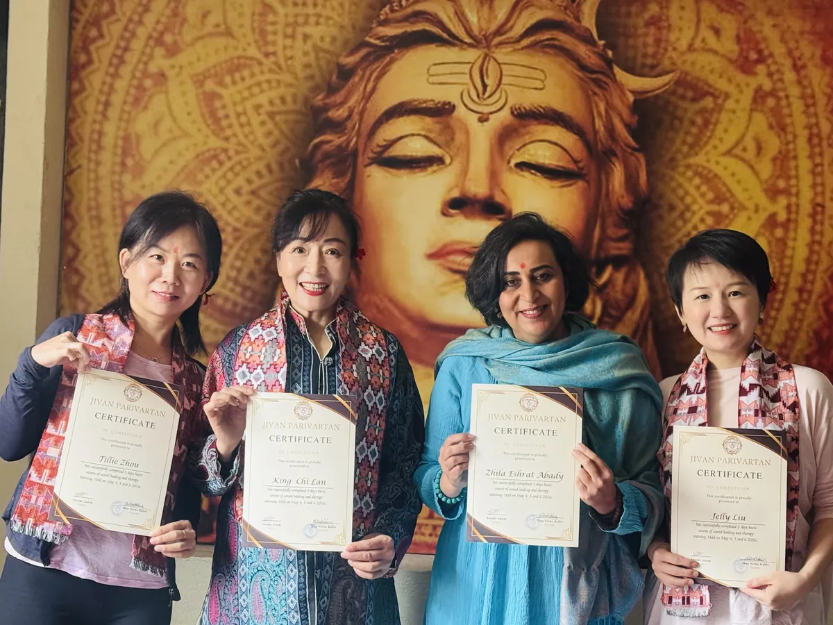 Four graduates holding their certificates after completing training at Jivan Parivartan