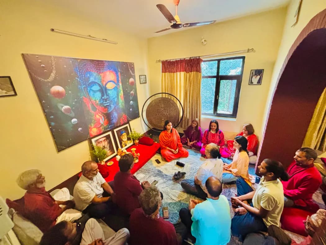 Students and teachers sitting together in a circle during an evening session at Jivan Parivartan
