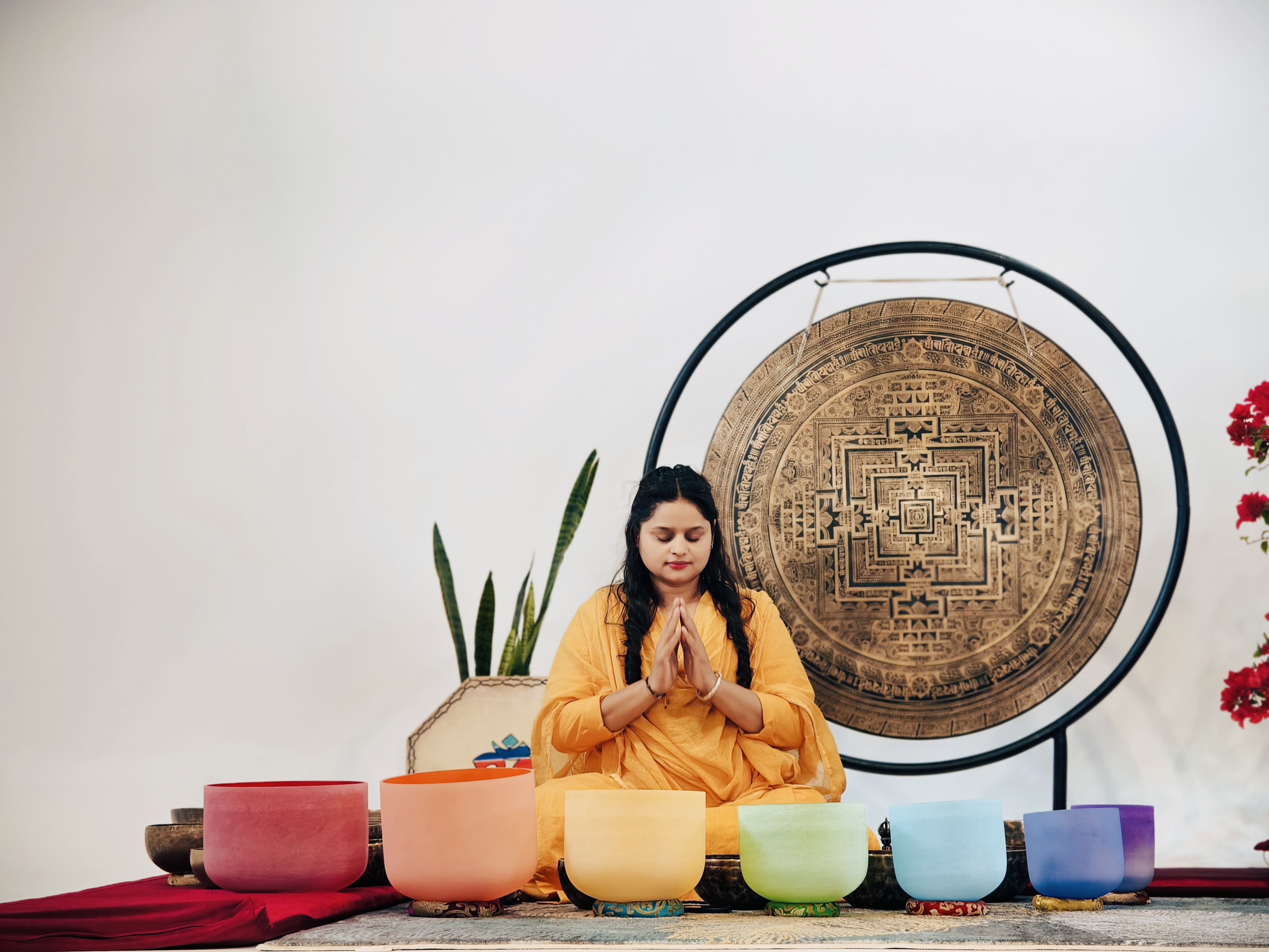 Singing bowl sound healing session at Jivan Parivartan, guests resting under blankets