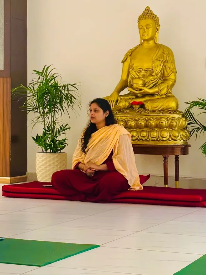 Maa Nisha Kabir seated in practice in the meditation hall at Jivan Parivartan